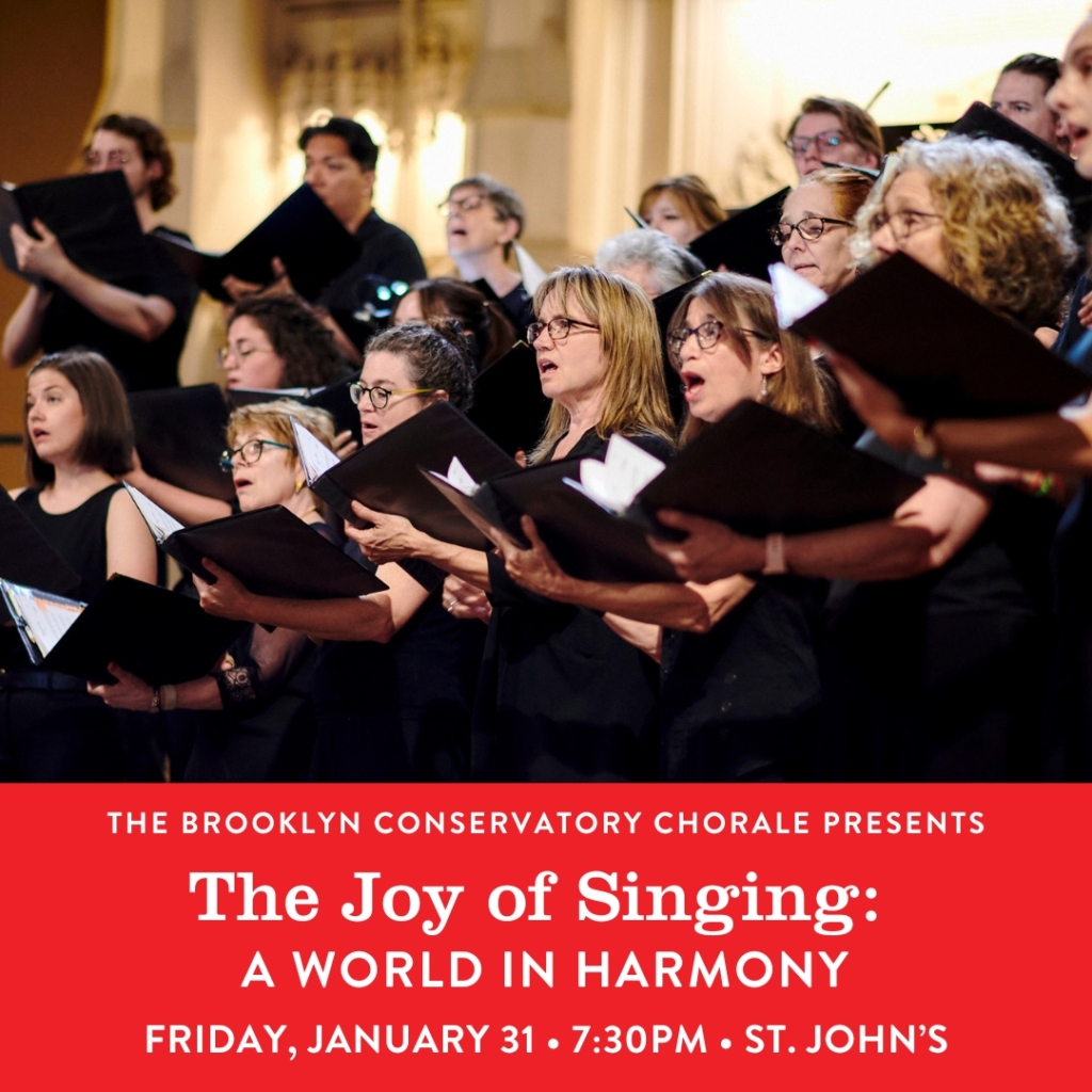 Members of the Brooklyn Conservatory Chorale holding music books and singing at a concert