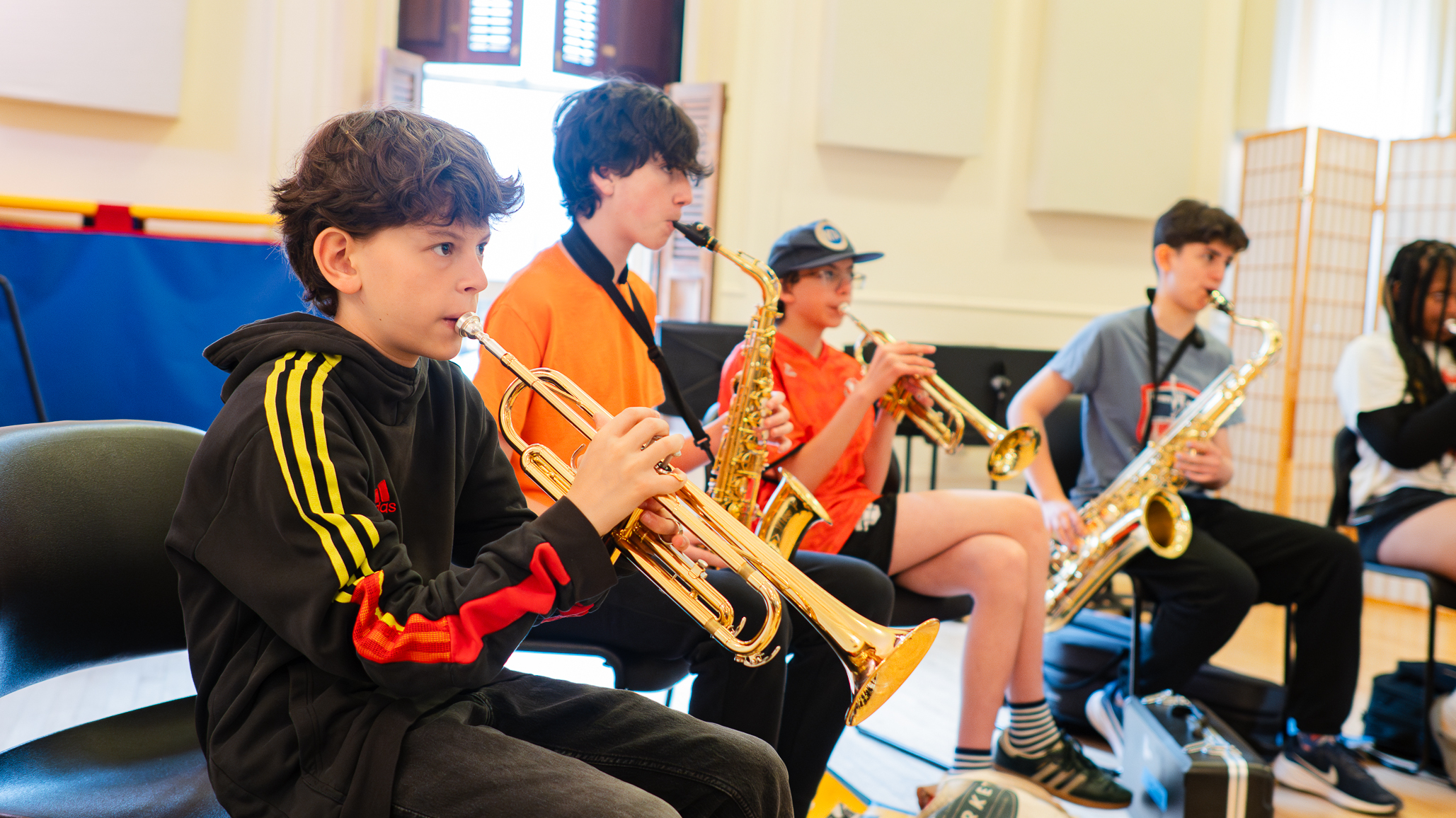 Students in Jazz Travelers playing together at rehearsal
