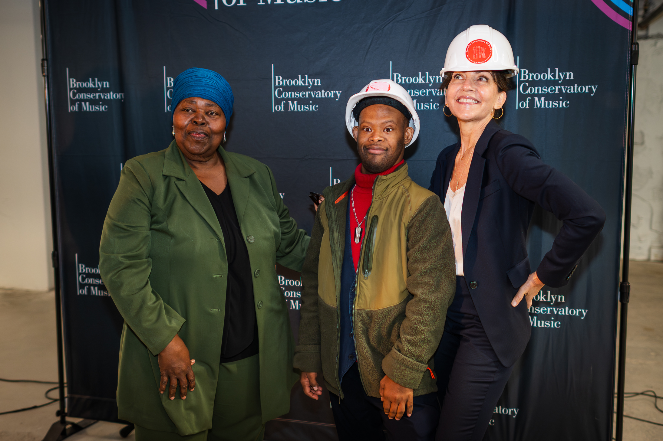 L to R: Joeretta, Oluyemi, and Toby Williams against a Brooklyn Conservatory of Music sign