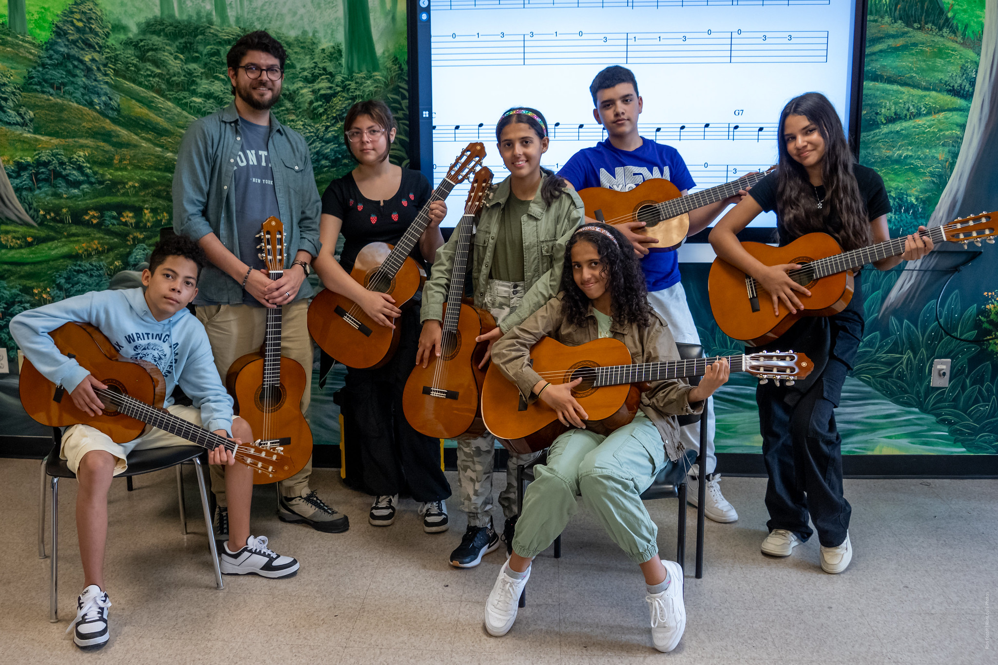 Students at IS 235 posing with guitars