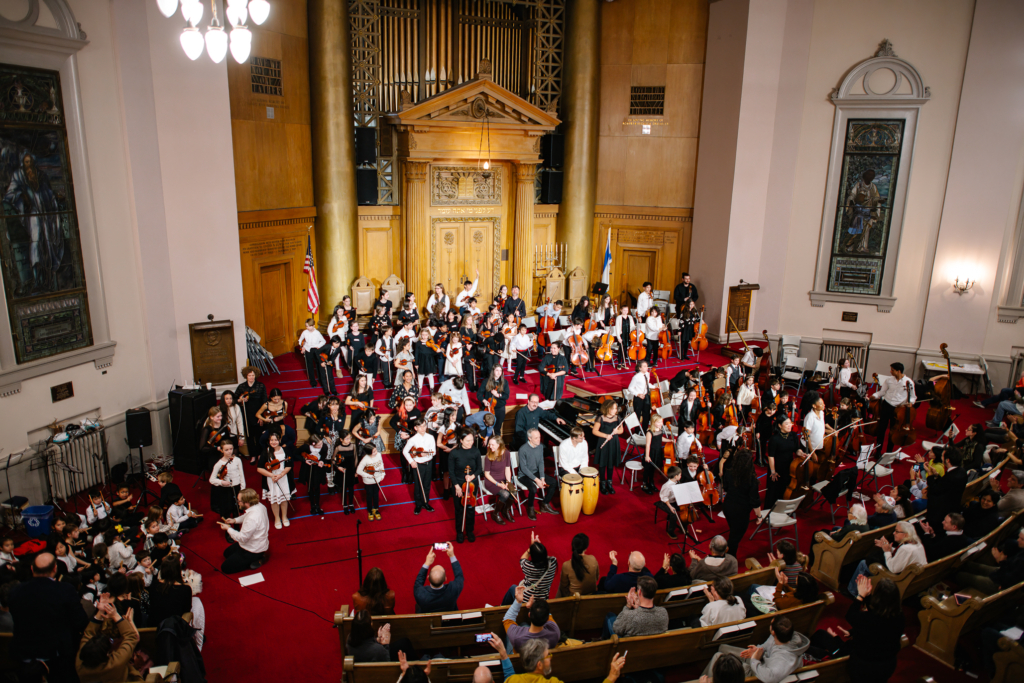 Suzuki cello, violin and bass students performing at Congregation Beth Elohim
