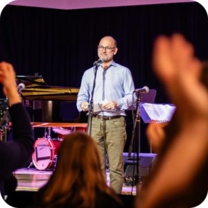 A photo of BKCM executive director Chad Cooper giving a speech