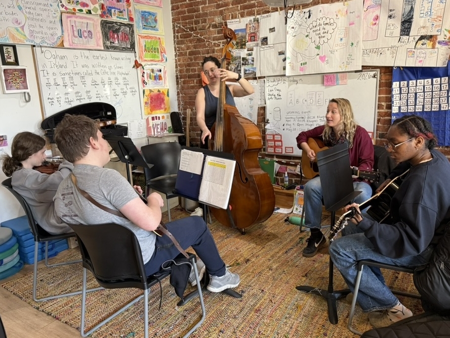 A picture of the Youth Bluegrass Lab jamming